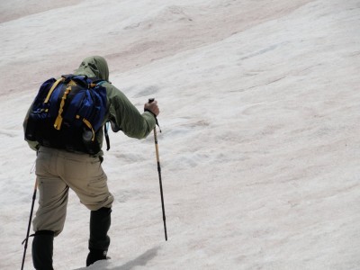 Hiking a short snow field.